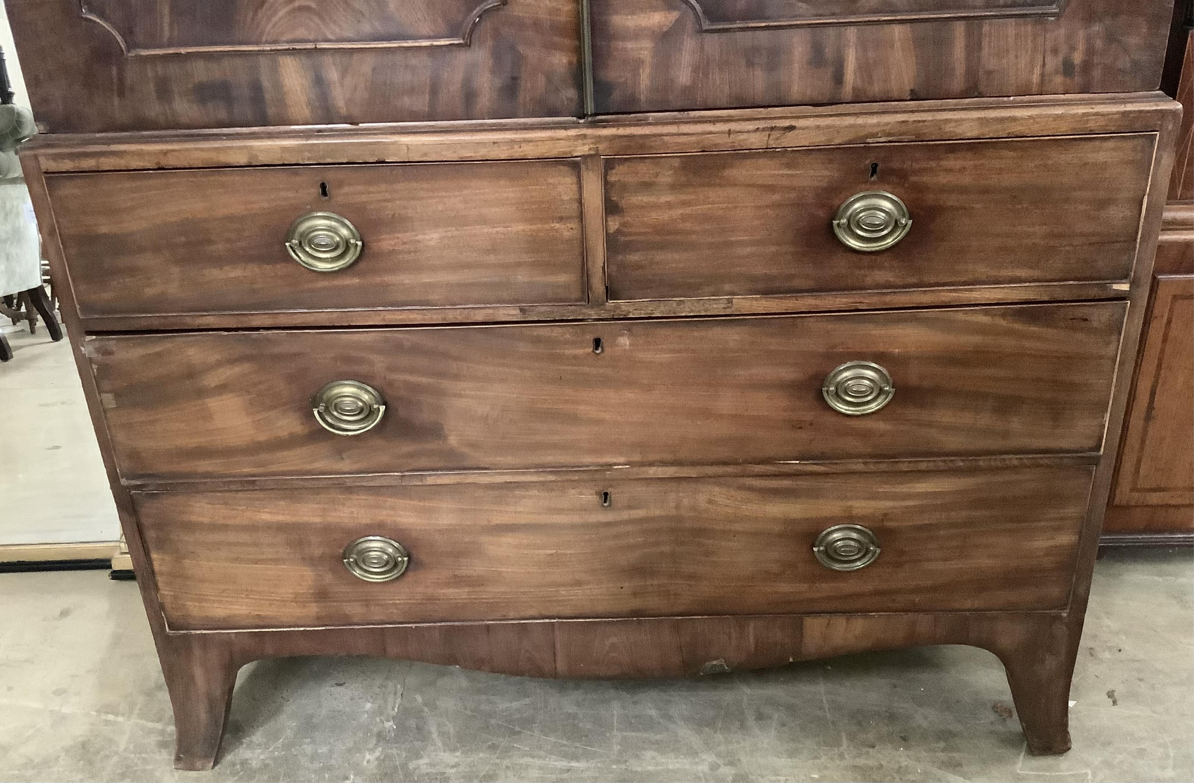 A George III mahogany linen press, width 130cm, depth 61cm, height 202cm. Condition - fair